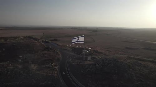 Israel Flag Waving Over Rural Landscape