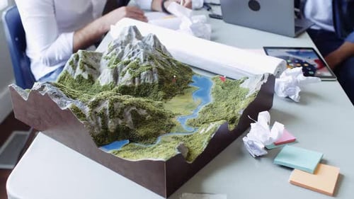 Environmental activists brainstorming mountain development ideas in office