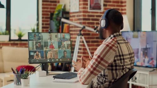 Man Attends a Virtual Meeting on Computer