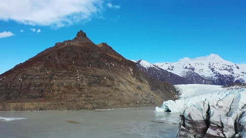 Aerial view of a blue glacier in Iceland. Cold Blue Ice, Frozen. Water Arctic winter landscape.