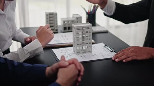 Businesspeople sell buy mortgage and signing agreement for apartment financial