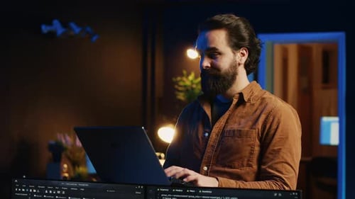 Portrait of Smiling Man Doing IT Support Job From Home Standing in Office