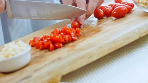 The Woman Cuts Tomatoes