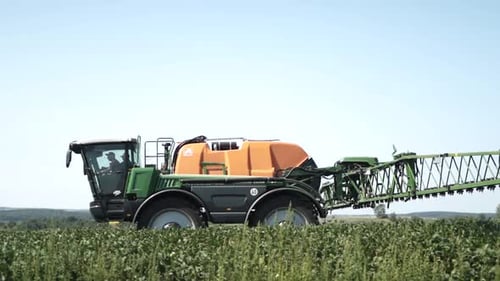 Spray Fertilize On Field With Chemicals In Agriculture Field