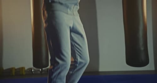 Active Man Jumping Skipping Rope in Sport Club