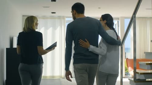 Professional Real Estate Agent Shows Stylish Modern House to a Beautiful Young Couple Who are in th