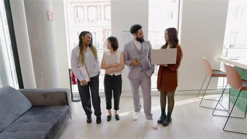 A Diverse and Dynamic Business Team Collaborating in a Contemporary Office Environment