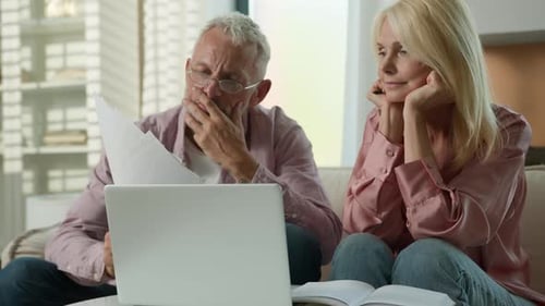 Worried Senior Caucasian Married Couple Man Woman Checking Bills Bank Loan Payment Learn Documents
