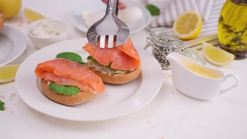 Gourmet Sandwich Preparation with Salmon and Spinach