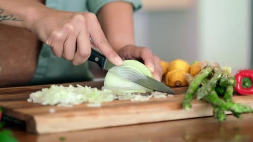 Chopping an Onion on a Cutting Board