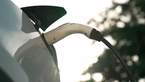 EV electric vehicle recharging battery in national park. Exalt