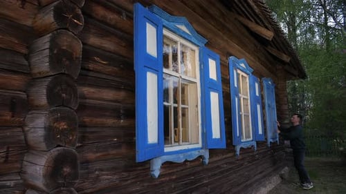 Concept of End and Completion Closing the Window Shutters on the Window
