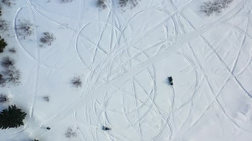 Snowmobiles Trace Patterns on Pristine Winter Landscape