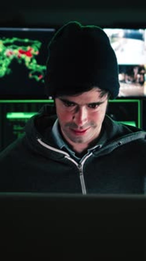 Vertical Individual Close Up Portrait of a Concentrated Hacker Man Programmer or Developer Typing