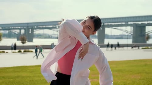 Girl Dancer Dancing Energetic Dance on the Street in Urban Atmosphere