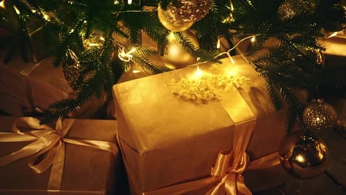 Christmas Tree with Golden Ornaments and Gifts