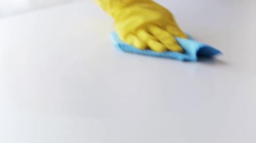 Cleaning a White Surface with a Cloth