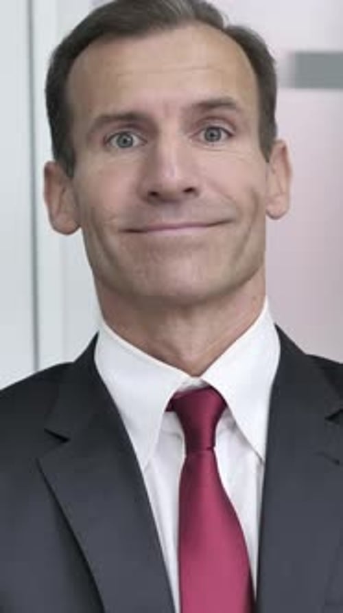 Man Wearing Suit Smiling and Winking Close-up Portrait