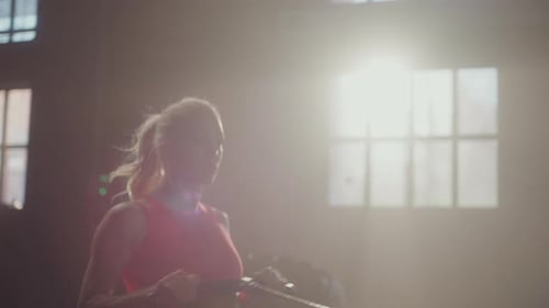 Fit Woman Working Out on Rowing Machine