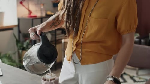 Creative Woman Preparing Herself Drip Coffee in Workshop