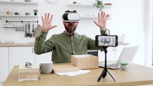 Man Using VR Headset at Home Recording Video