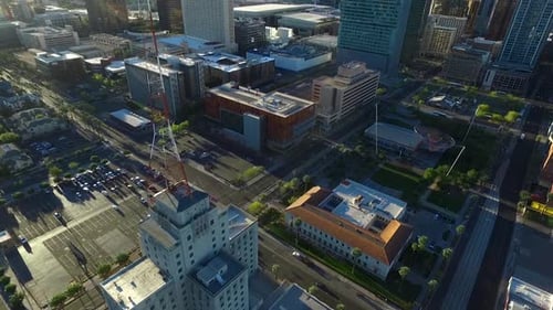Rising aerial view of a cell tower in the Phoenix downtown area.