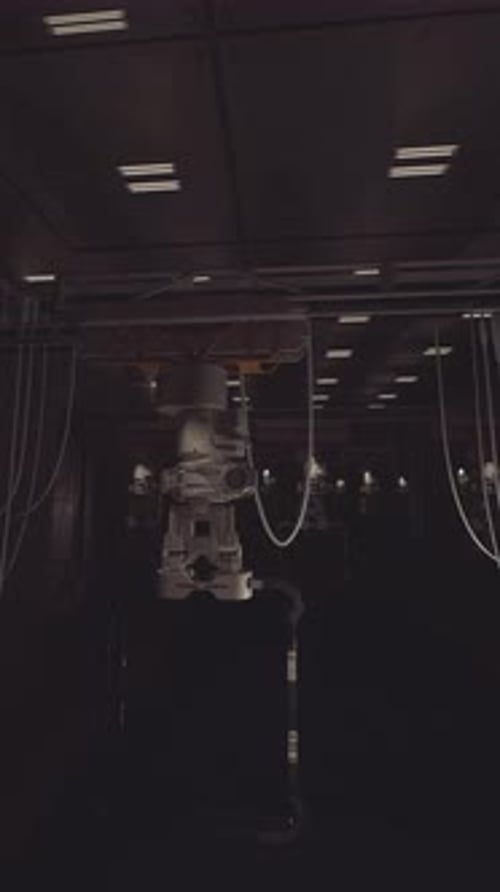 Robotic System Works in a Futuristic Lab at Night