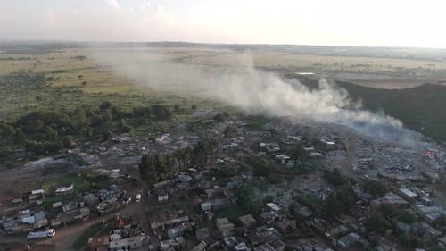 Captivating 4K aerial footage features a push-in drone shot, seamlessly revealing a rural township v