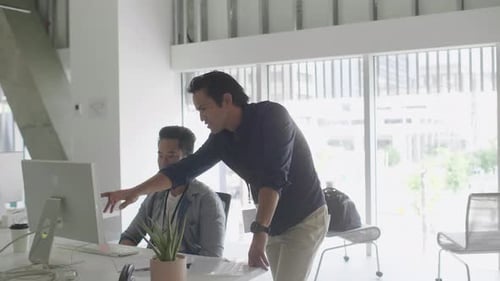 Businessmen Talking Planning At Computer In Office