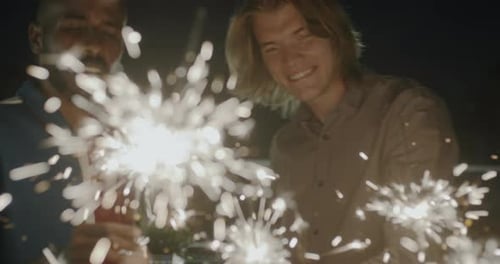 Friends Celebrate with Sparklers at Night