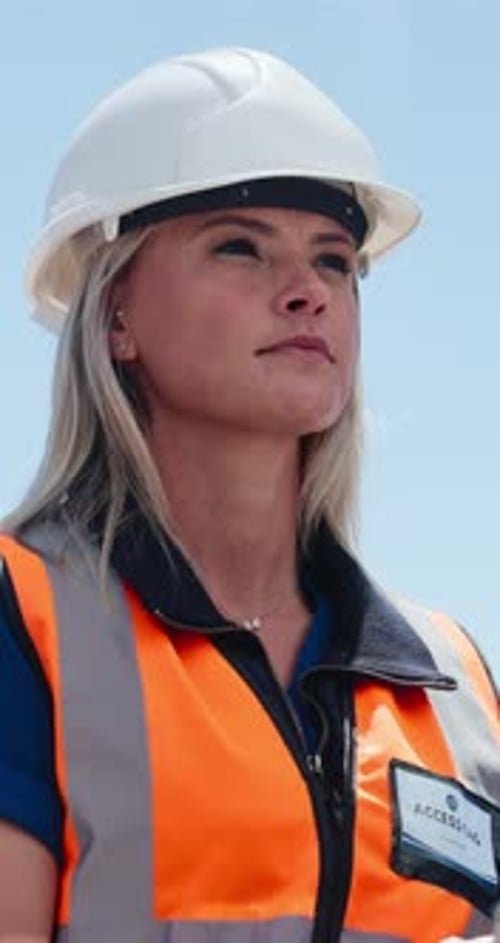 Thinking, engineer and woman outdoor for construction, planning or low angle