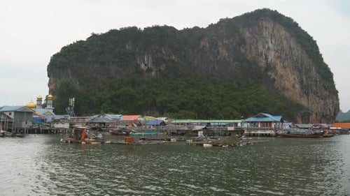 Koh Panyee Fishing Village With Limestone Cliff In The Background In Phang Nga Province, Thailand. S