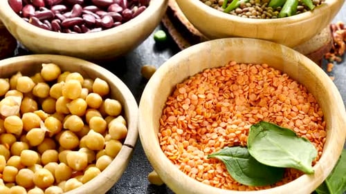 Assorted Beans and Legumes in Wooden Bowls