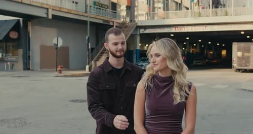 Romantic Couple Embracing Affectionately in Urban Setting