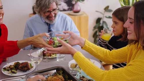 Friends and Family Gather Together For Mealtime