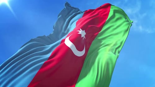 Realistic Waving National Flag Against Blue Sky Background