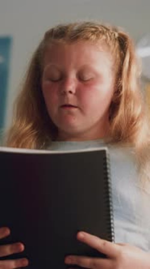 Primary School Girl Speaking Showcasing Knowledge of Geography in Front of Classmates and Teacher