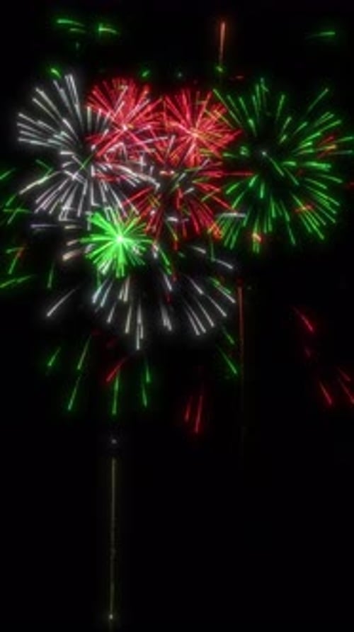Looping Red White and Green Fireworks Display Background