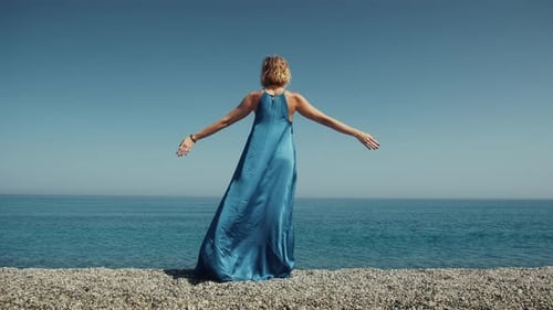 Woman Feeling Free In Front Of The Ocean Water