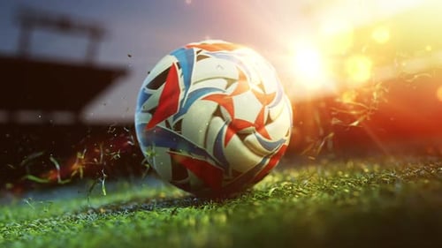 Soccer ball spinning on sunny stadium grass.