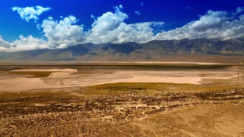 Dry landscape with no greenery. Scenery of Death Valley on sunny daytime from top.