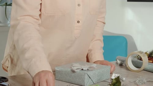 Gift Wrapping: Finishing Touches on Beautifully Wrapped Present