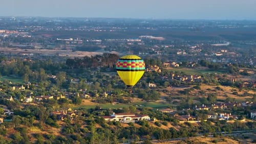 Hot Air Balloon Floating Over Suburban Landscape