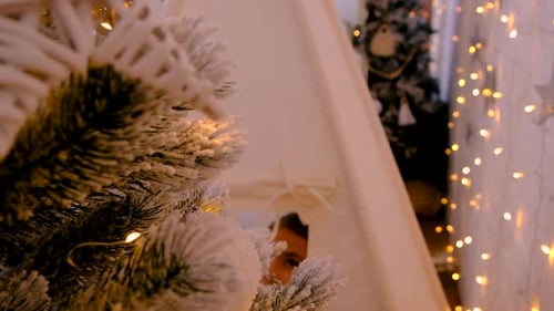 Children Play in Teepee Near Christmas Tree