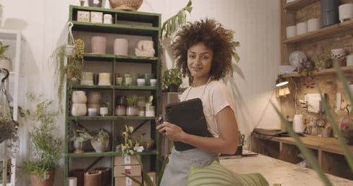 Portrait of Small business entrepreneur afro American female Store Owner looking at camera in shop