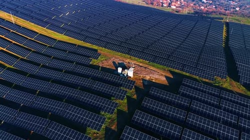 Footage over the numerous photovoltaic cells facing sunlight. Sustainable energy concept.