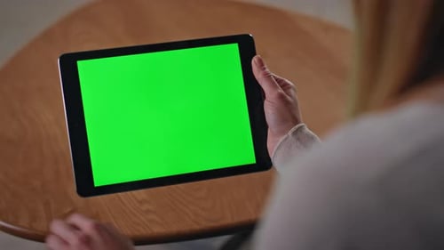 Businesswoman Hands Browsing Green Screen Tablet Application at Home Close Up