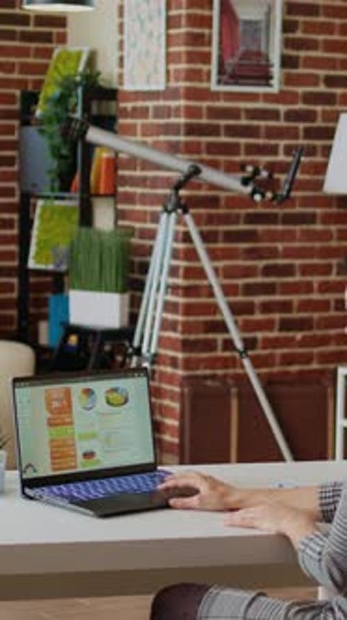 Vertical Video Remote Employee Optimizing Market Performance Charts at Home