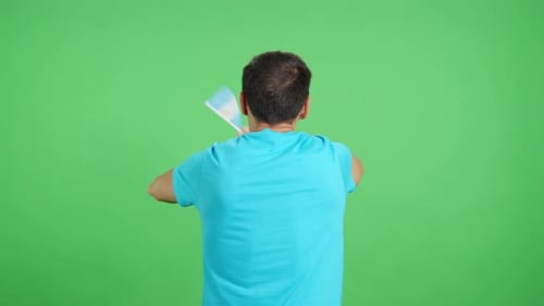 Rear View of a Man Waving a Argentine Pennant