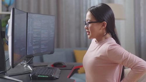 Asian Teen Girl Programmer Having A Backache While Creating Software Engineer Developing App